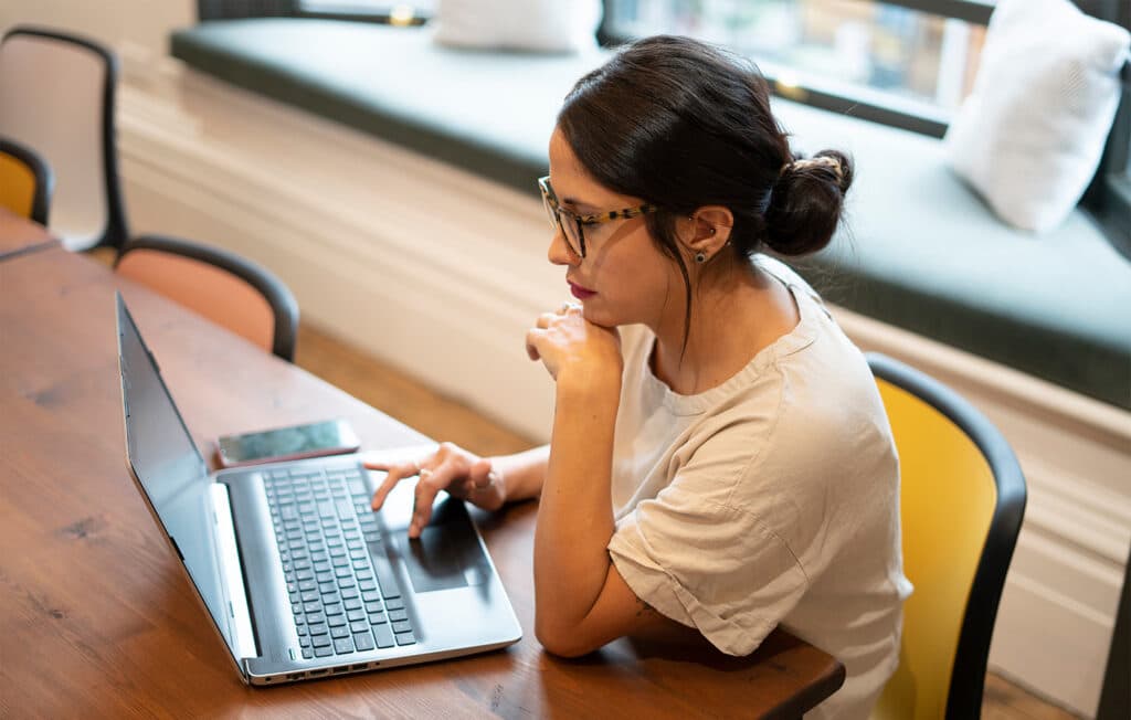 Woman working on laptop in office