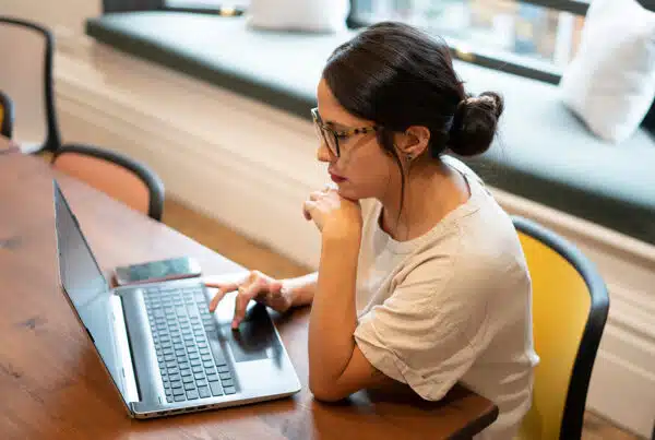 Woman working on laptop in office