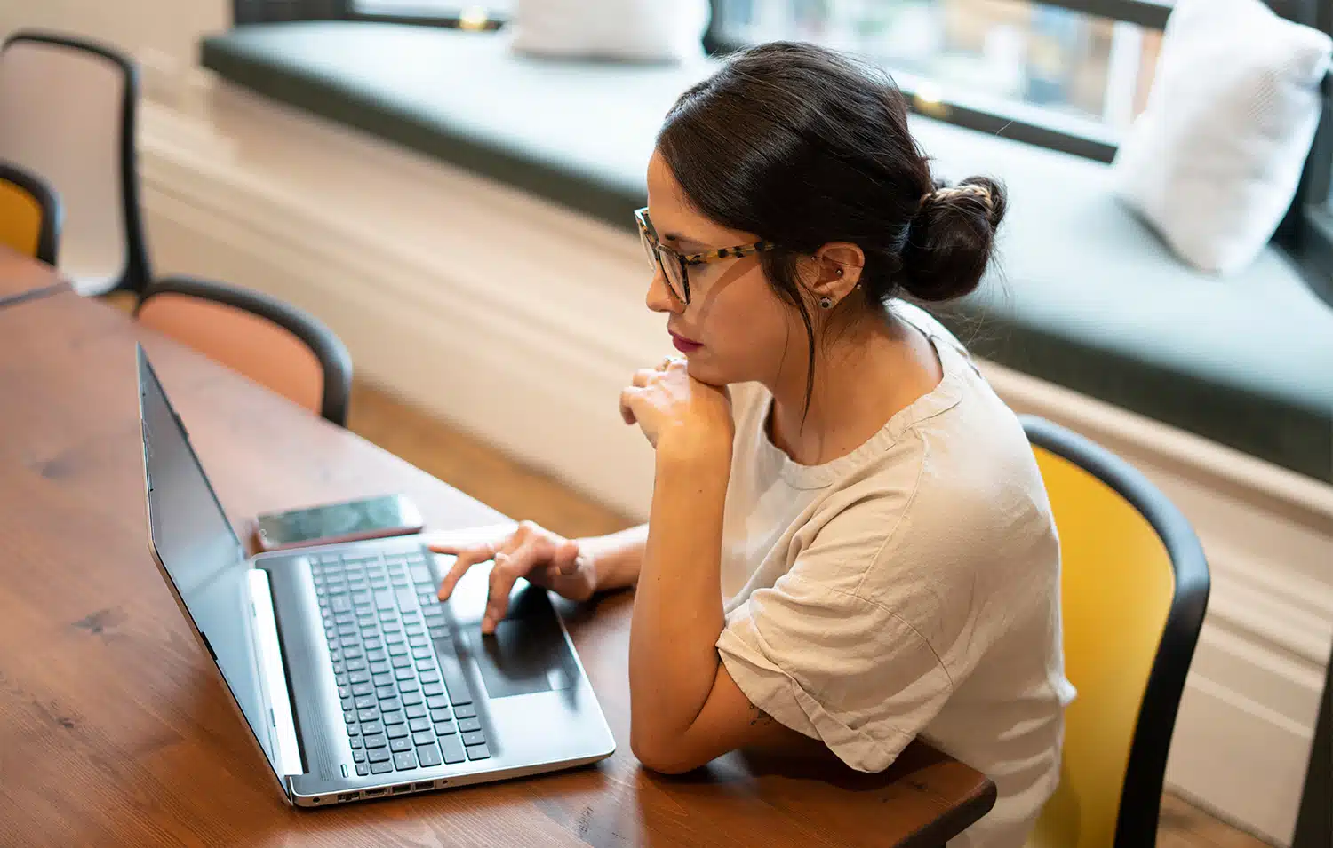 Woman working on laptop in office